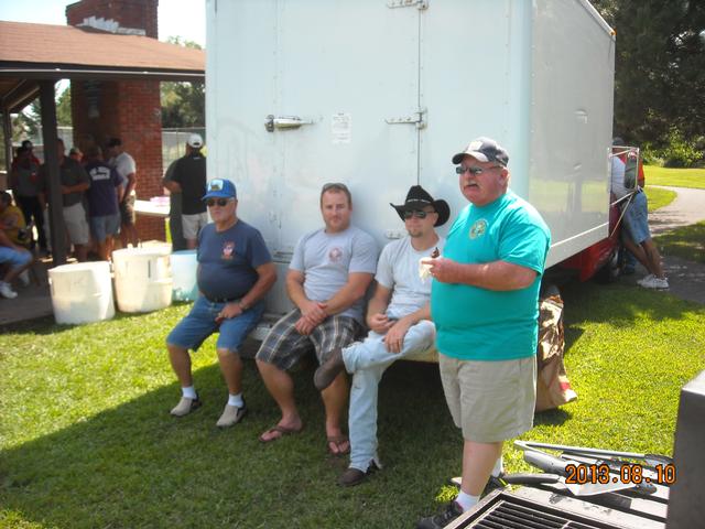 Herb Click telling one of his many stories.  The guys sitting on the truck look real interested.  Summer Feed 2013